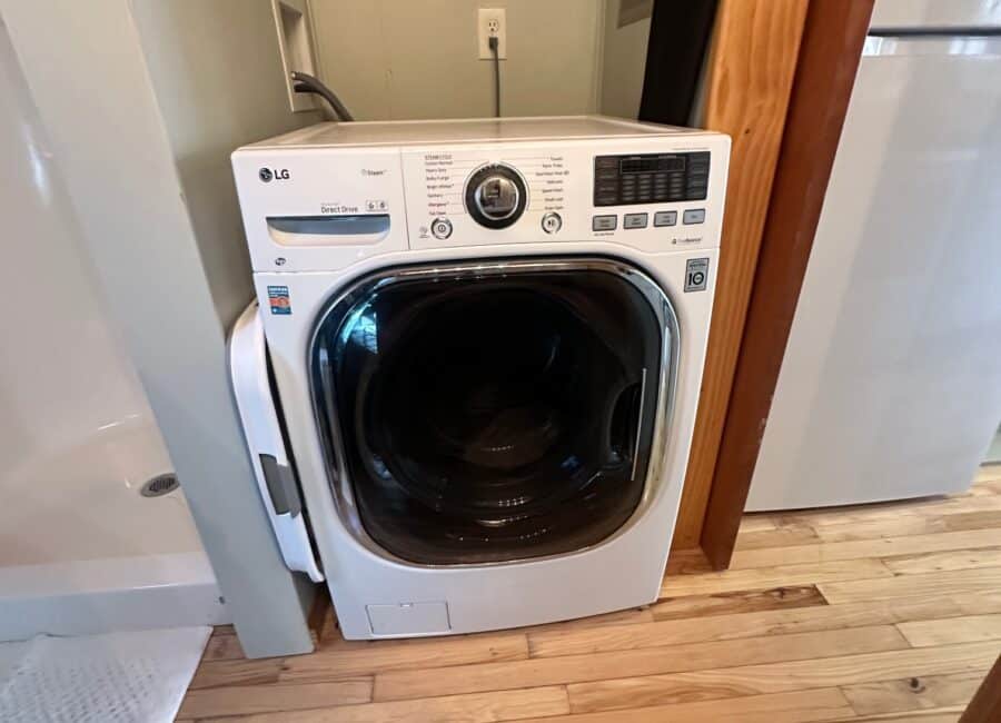 LG front-load washing machine in compact space.