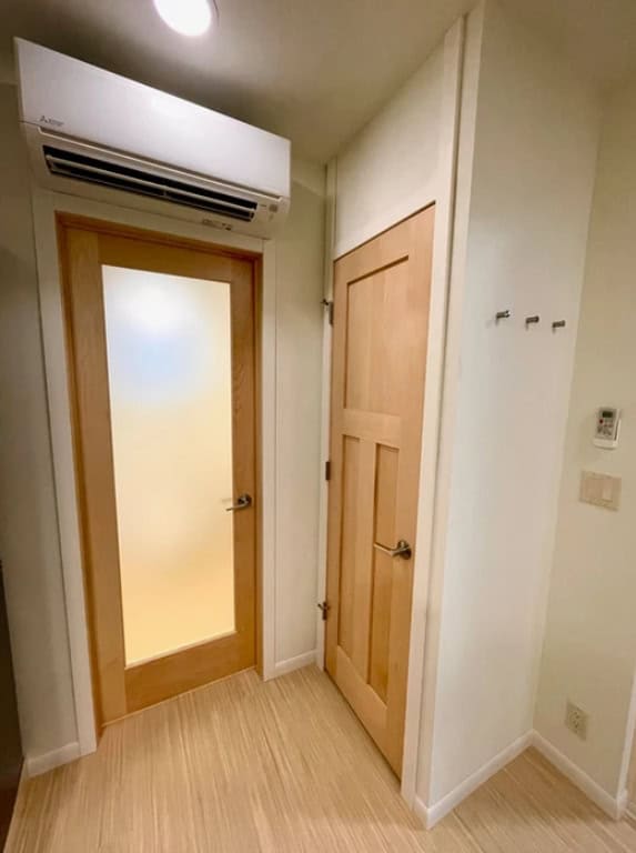 Front closet with hooks for coats and storage