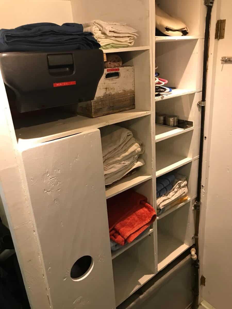 Compact tiny house storage with standing loft for efficient space use.