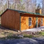 Cozy 714 sq. ft. wooden cabin nestled in the woods, perfect for small space living and outdoor retre.