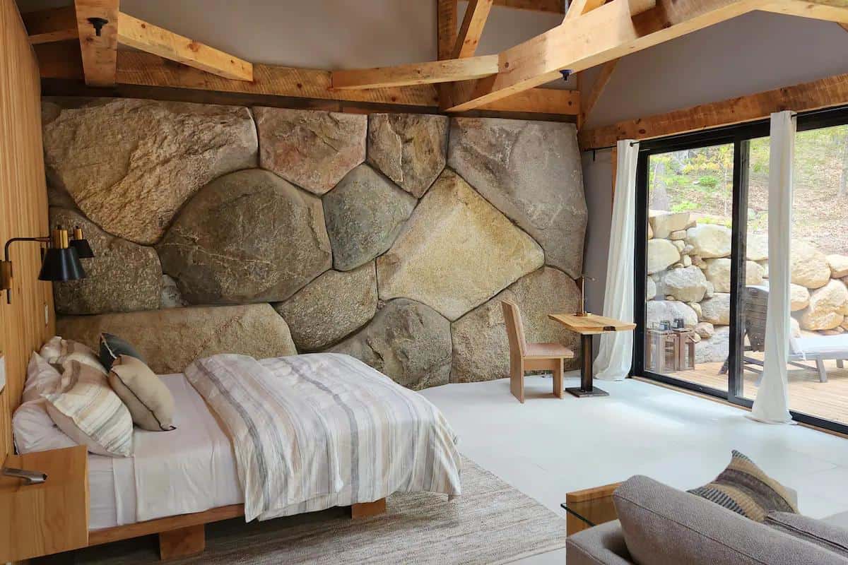 New Hampshire Boulder Cabin Built Around a Massive Rock Wall