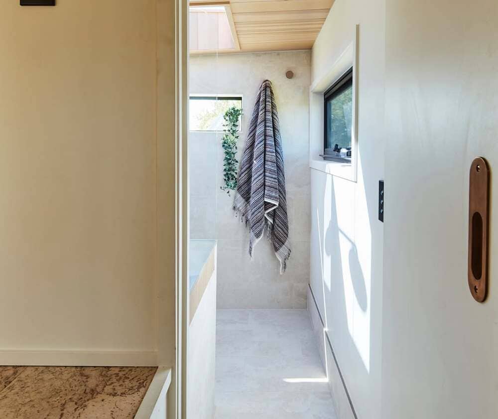 Full bathroom in the NOOSA tiny house with earthy materials