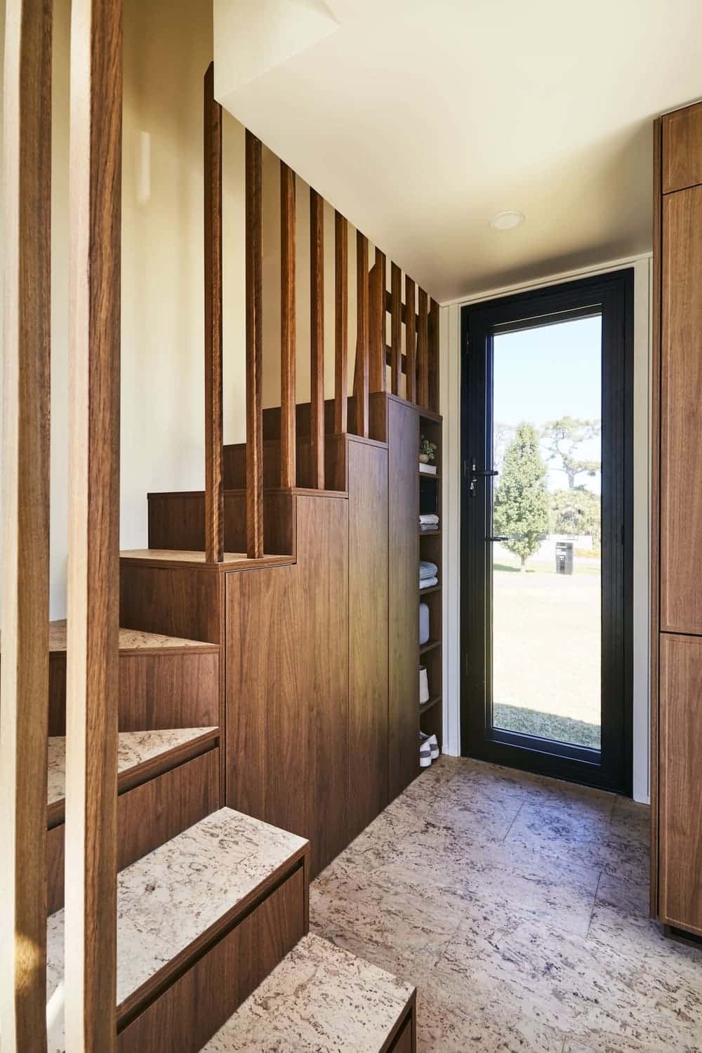 Entry of the NOOSA tiny house showing warm wood detailing