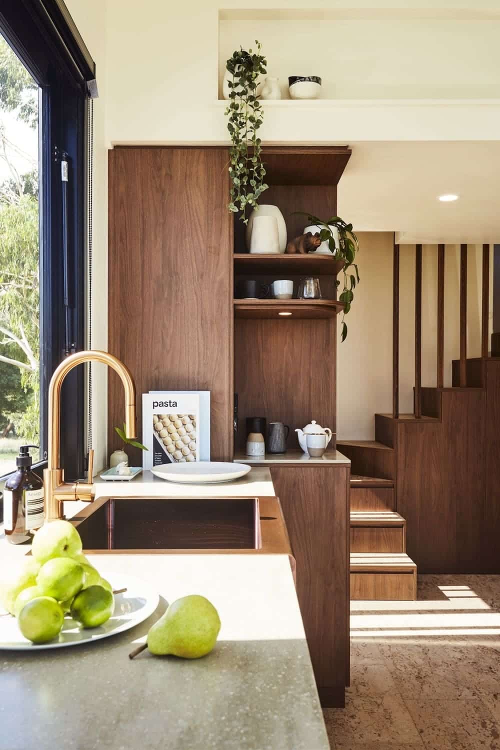 Full kitchen in the NOOSA tiny house with a long benchtop and breakfast bar