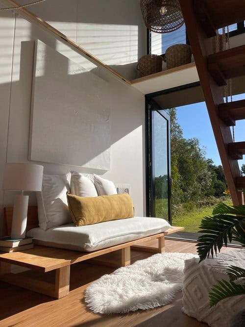 Bright interior of the Oslo Two-Story Tiny House by Little Byron, showcasing modern design and effic.