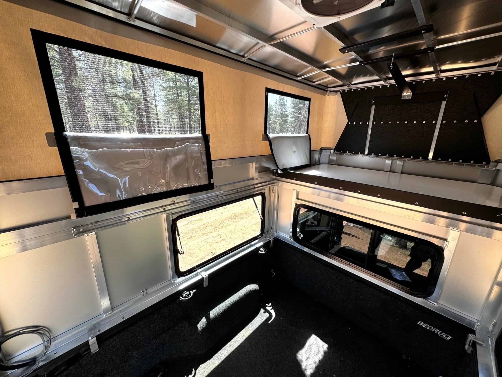 Detail view of the OVRLND Bread n Butter camper showing the straight-wall construction and canvas siding