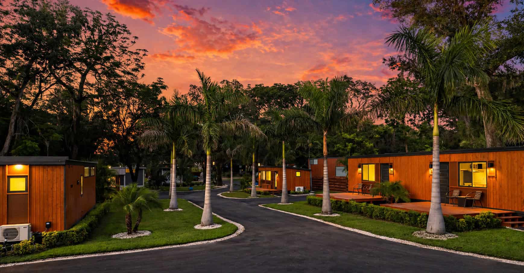 Peaceful Palm Court at Escape Tampa Bay with the N2 tiny house on the left