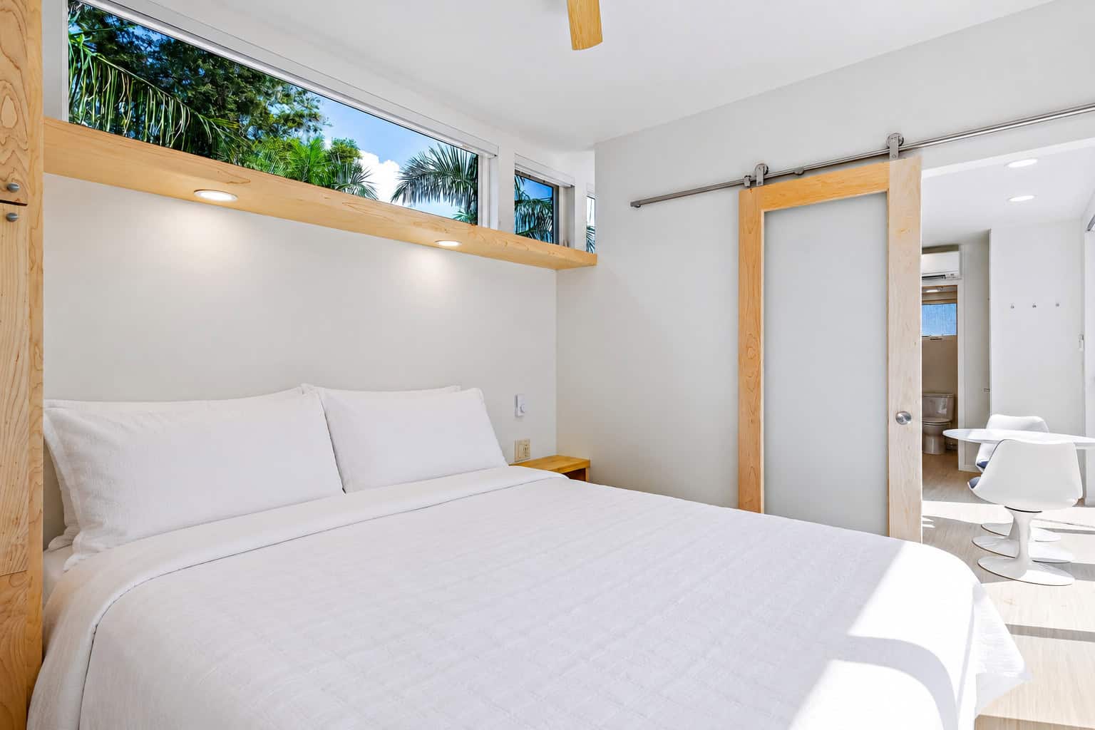 Private king bedroom with reading lights in the Escape N2 tiny house
