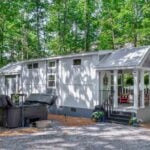 Charming tiny house on a wooded lot in Mentone, Alabama, perfect for small space living and outdoor.