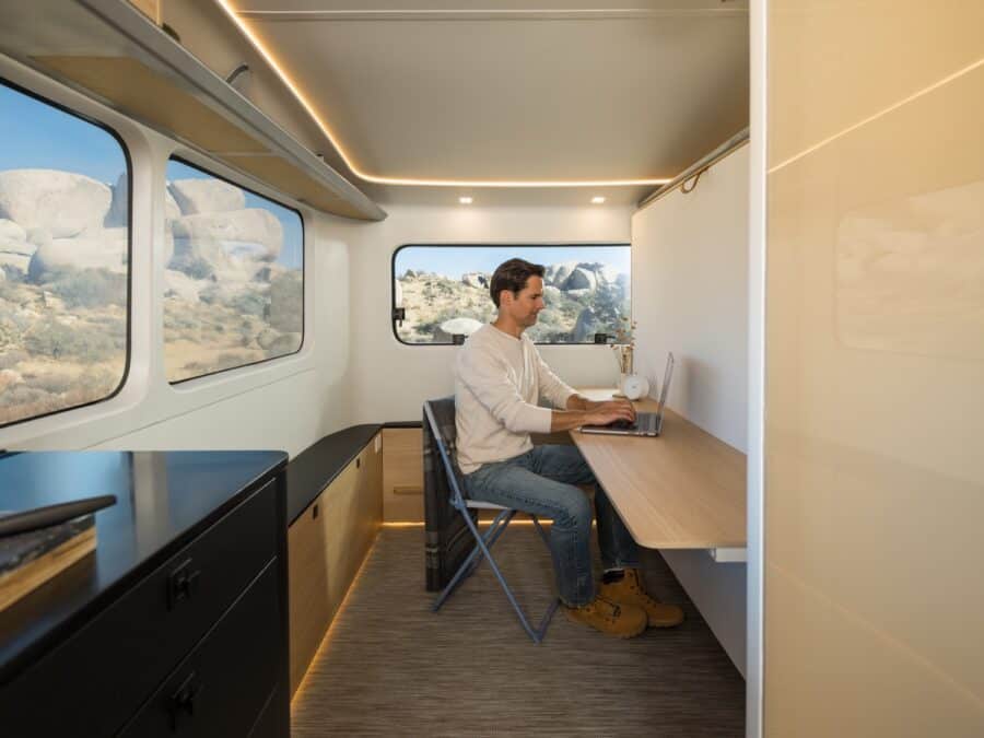 Pebble Flow electric trailer interior with Murphy bed and office desk