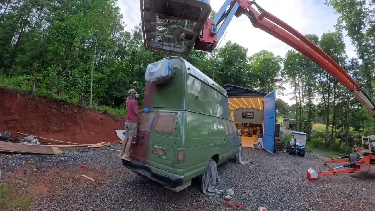Rear of the van showing the mini-split air conditioner and spare tire