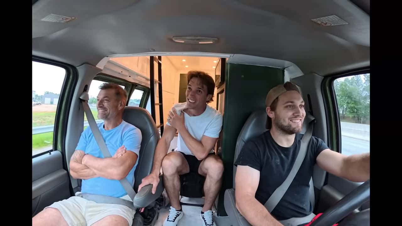 Three people riding in the cab during the van’s first road test