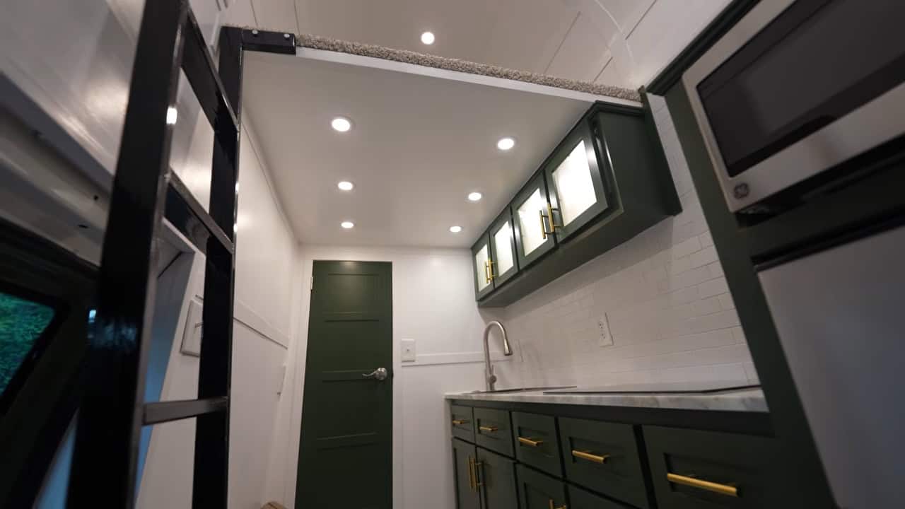 Builders lifting the original metal roof off the Ford E350 van