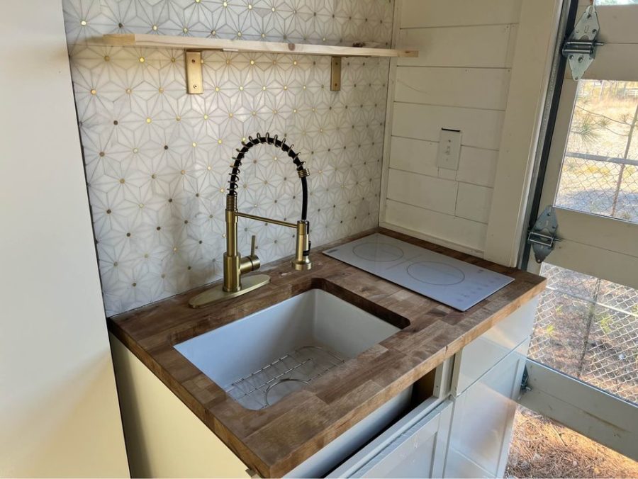 Pull-Out Under-Floor Bed in This Tiny House for Sale 7