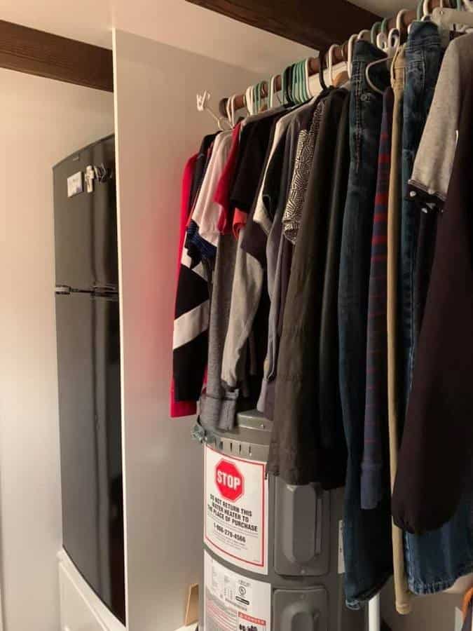 Compact closet in Alki Tiny House by Seattle Tiny Homes.