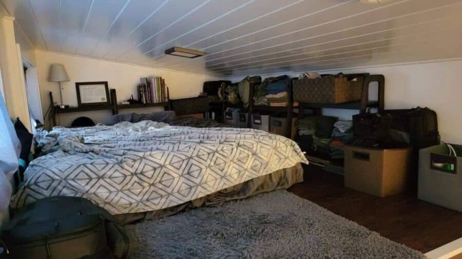Interior view of the Alki Tiny House showcasing compact living space and smart storage solutions.
