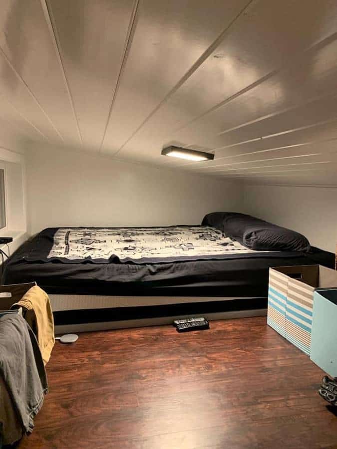 Alki Tiny House bedroom interior with compact sleeping area and minimalist decor.