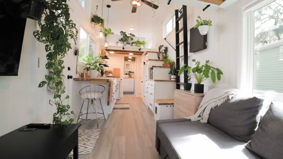 Rebekah tiny house living room looking toward the kitchen and storage stairs