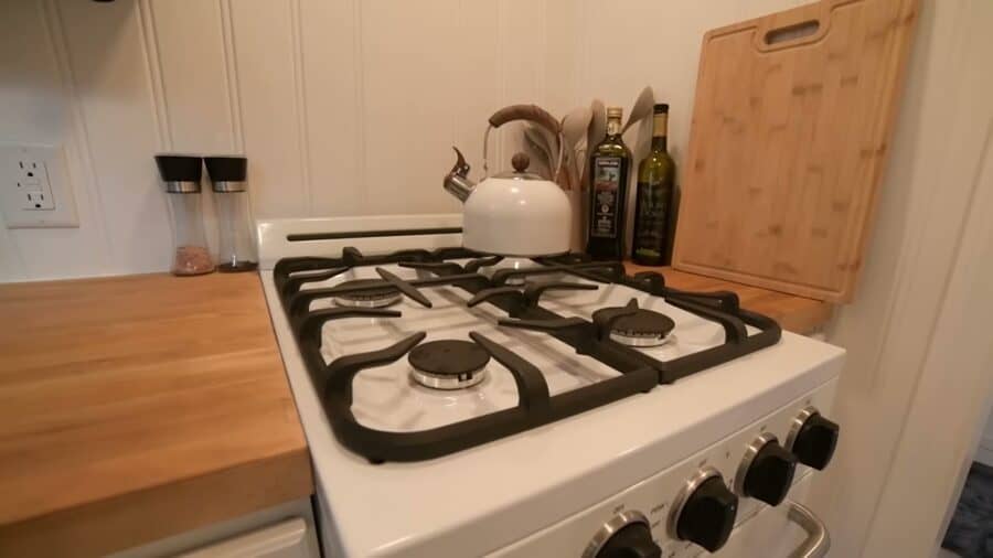 Propane four-burner range and butcher block counter in a tiny house