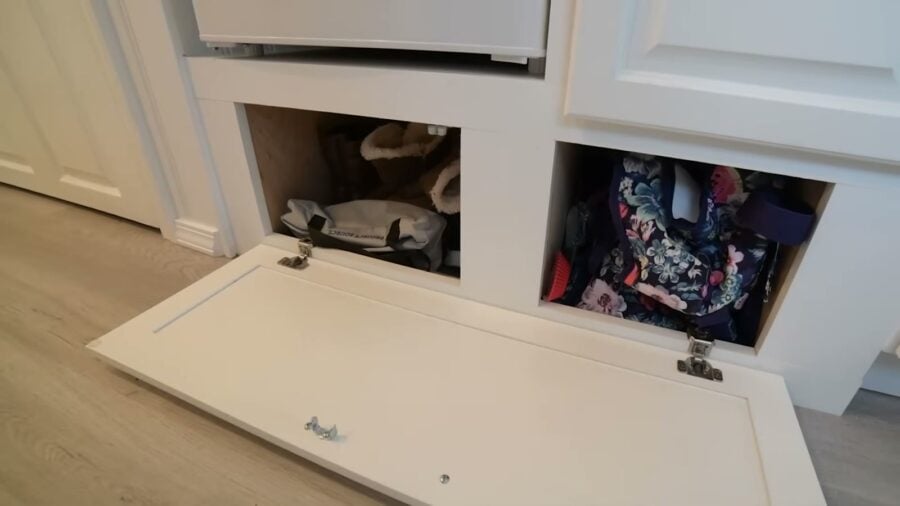 Storage cubbies built over the trailer wheel well in a tiny house