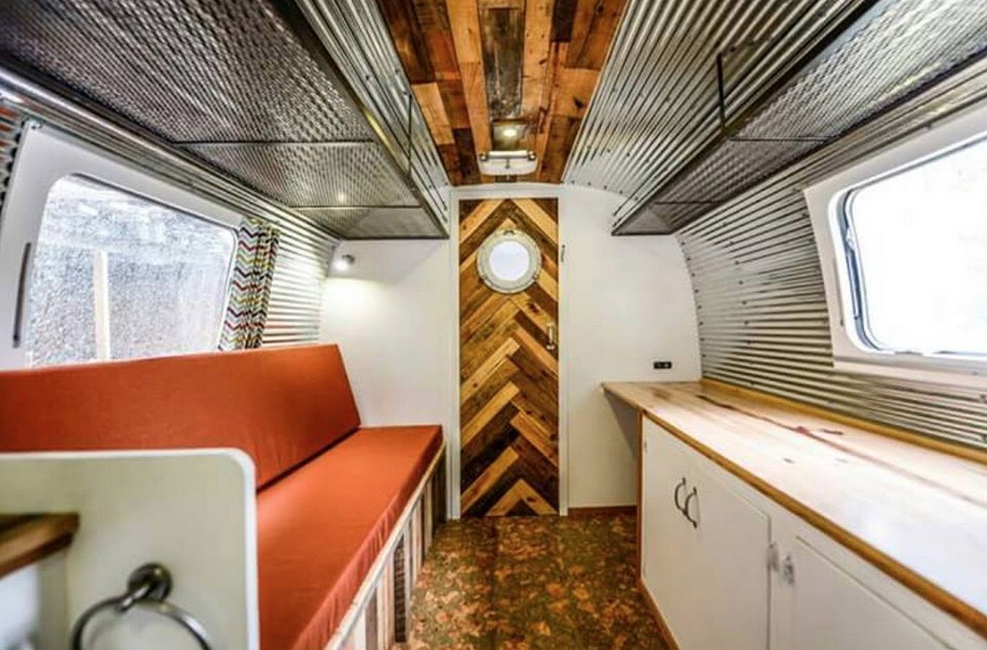 Renovated 27-foot Airstream Tiny House by Wind River Tiny Homes - chevron wood accents