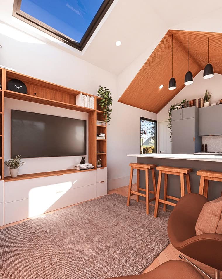 Modern tiny house living room with skylight, TV, and wooden accents.