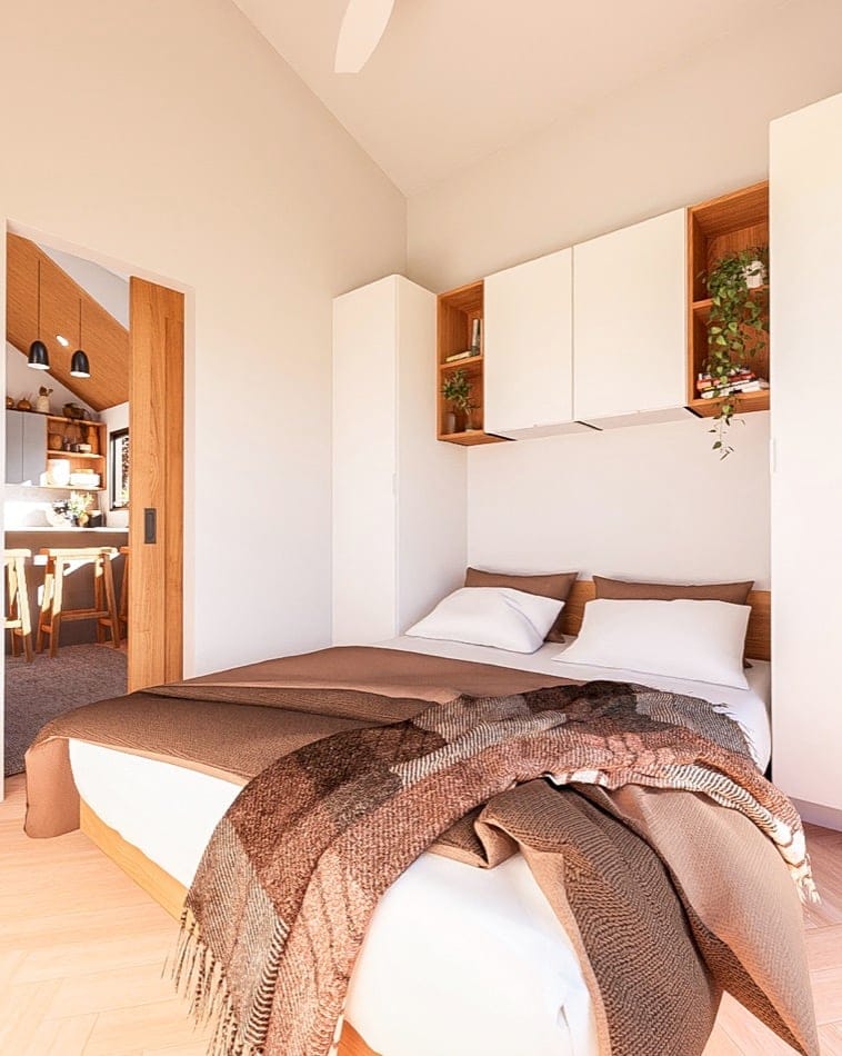 Tiny house bedroom with minimalist design and smart storage solutions.