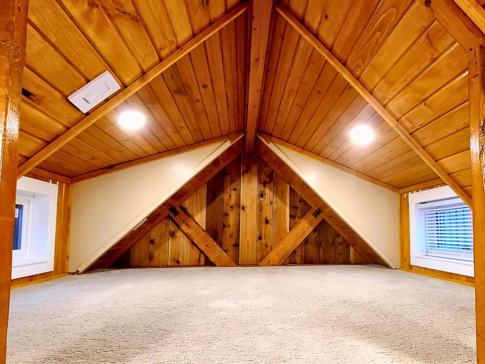 View toward the loft ladder and kitchenette counter inside the Honeycomb Mobile Office