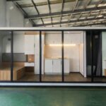 Compact tiny house interior with efficient kitchen, sleeping area, and bathroom in a small, modern s.