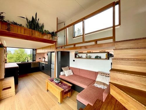 Compact Tiny House with Modern Kitchen and Cozy Living Area.