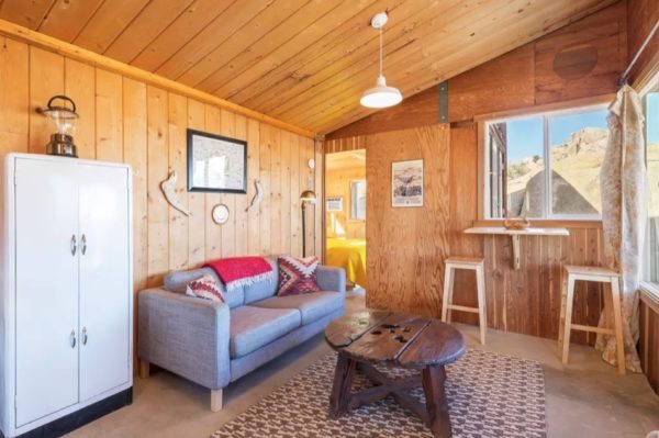 Rustic Tiny Cabin Nestled into Rocky Hillside 007