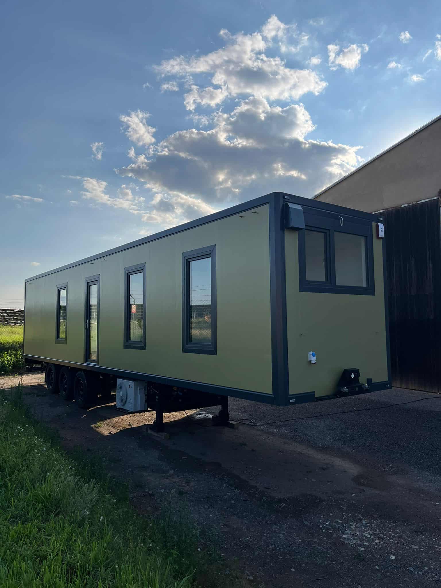 SEFR Home refrigerated trailer tiny house finished green exterior on triple-axle chassis with LG AC