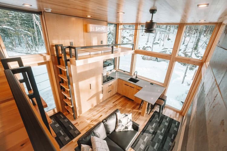 Cozy prefab SKALI cabin near Quebec City with modern wooden design and large windows.