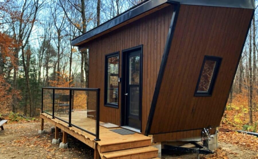 Modern tiny cabin with angular design in a wooded setting in Haliburton, Ontario.