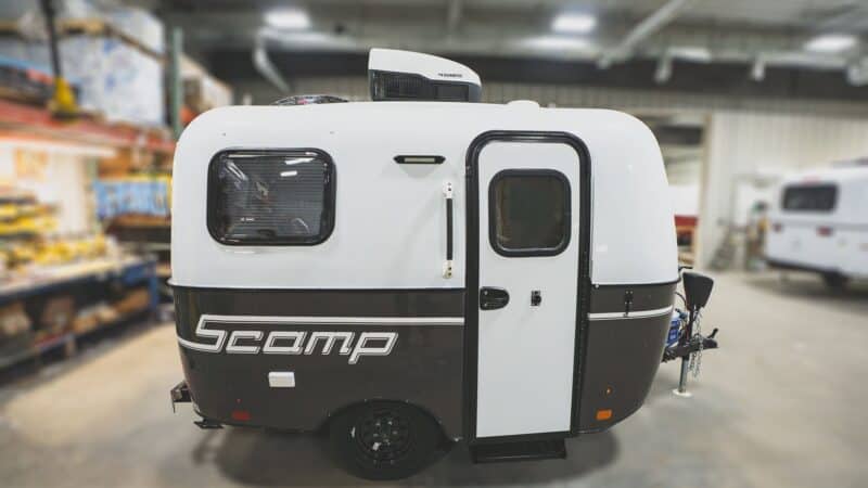 Scamp 13 with a dark grey lower shell in a showroom