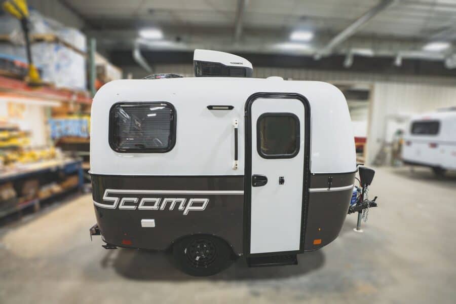 Scamp 13 with a dark grey lower shell in a showroom