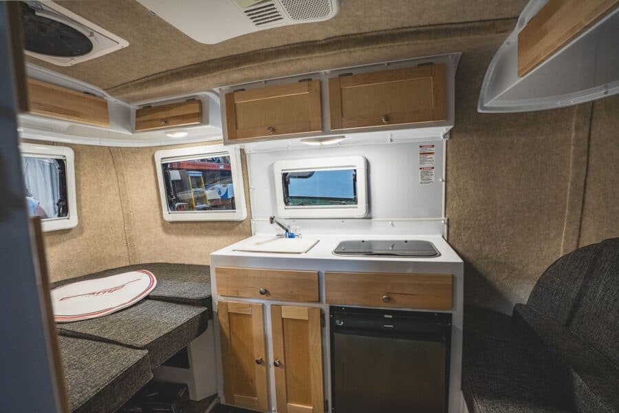 Rear bed and galley with white counters