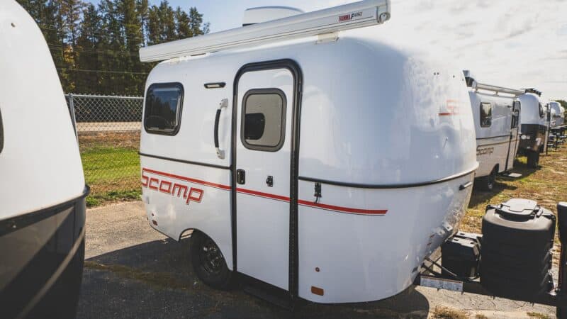 White Scamp 13 with a red stripe on a lot