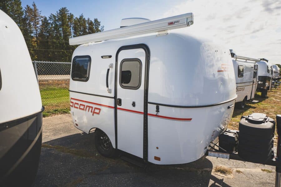 White Scamp 13 with a red stripe on a lot