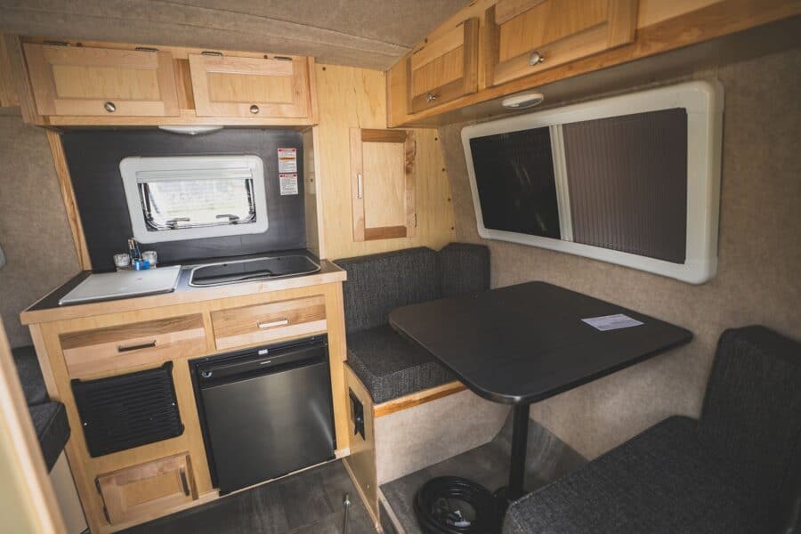 Galley with a refrigerator beside the front dinette