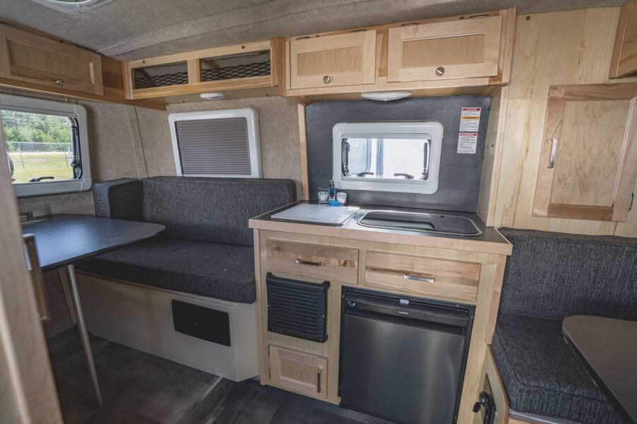 Rear dinette with a table and the galley
