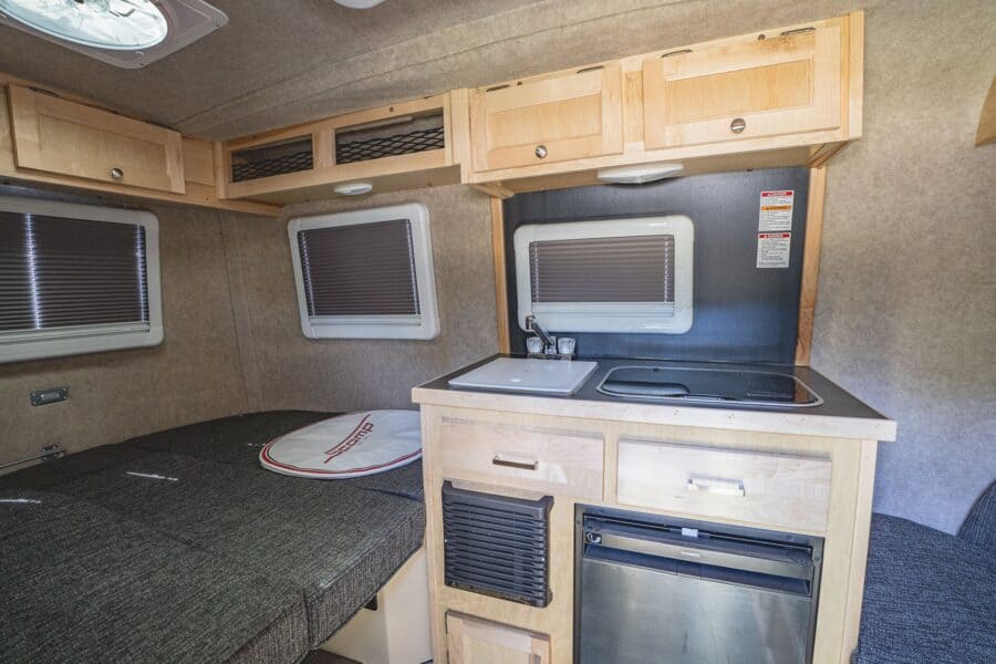 Rear bed and galley with maple cabinets