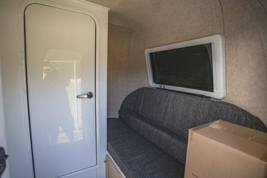 Front sofa bunk next to the white bathroom door