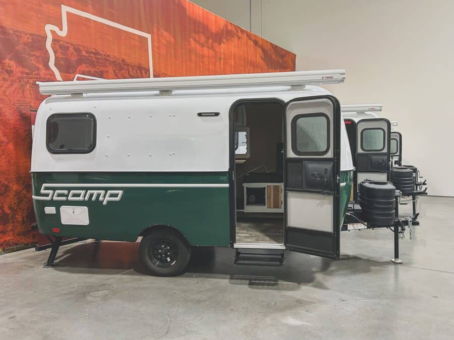Scamp 16 with a moss green lower shell and open door in a showroom