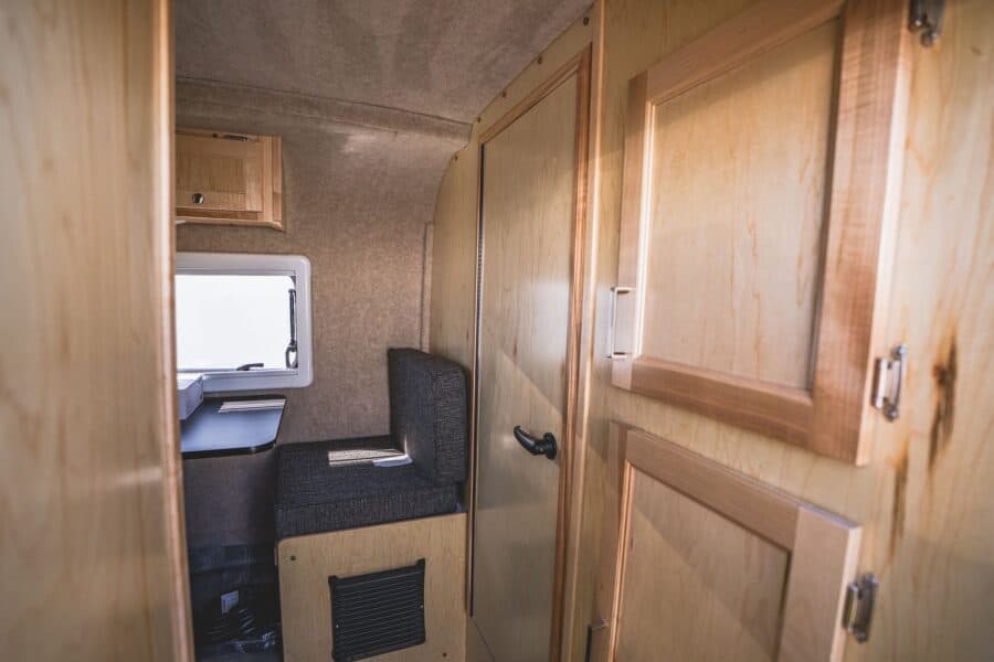 Wood bathroom and closet doors near the front