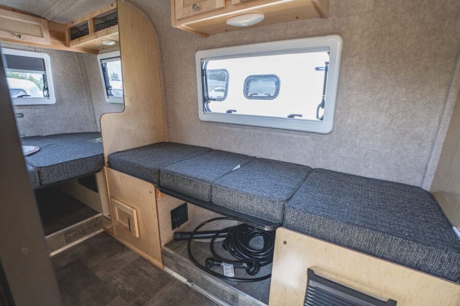 Side dinette benches and rear bed