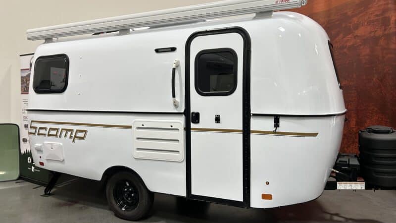 White Scamp 16 with a black stripe in a showroom