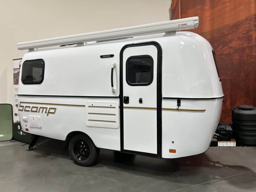 White Scamp 16 with a black stripe in a showroom