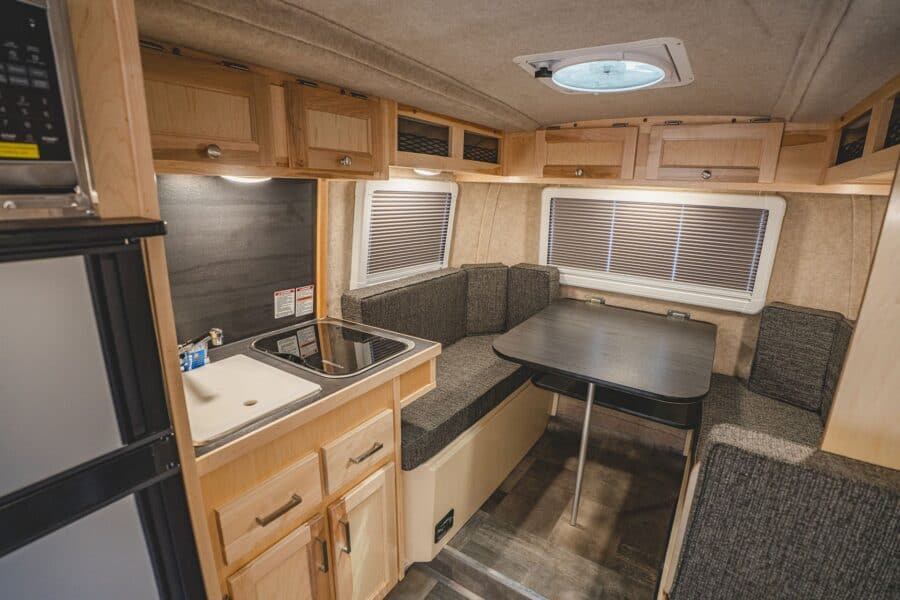 Galley sink and side dinette with a black table