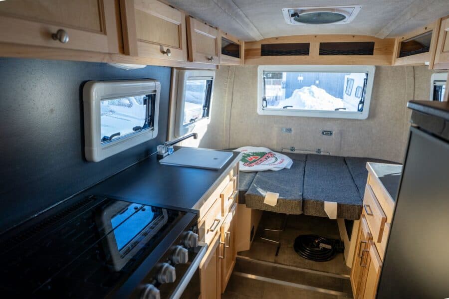 Stovetop and galley with the rear dinette beyond